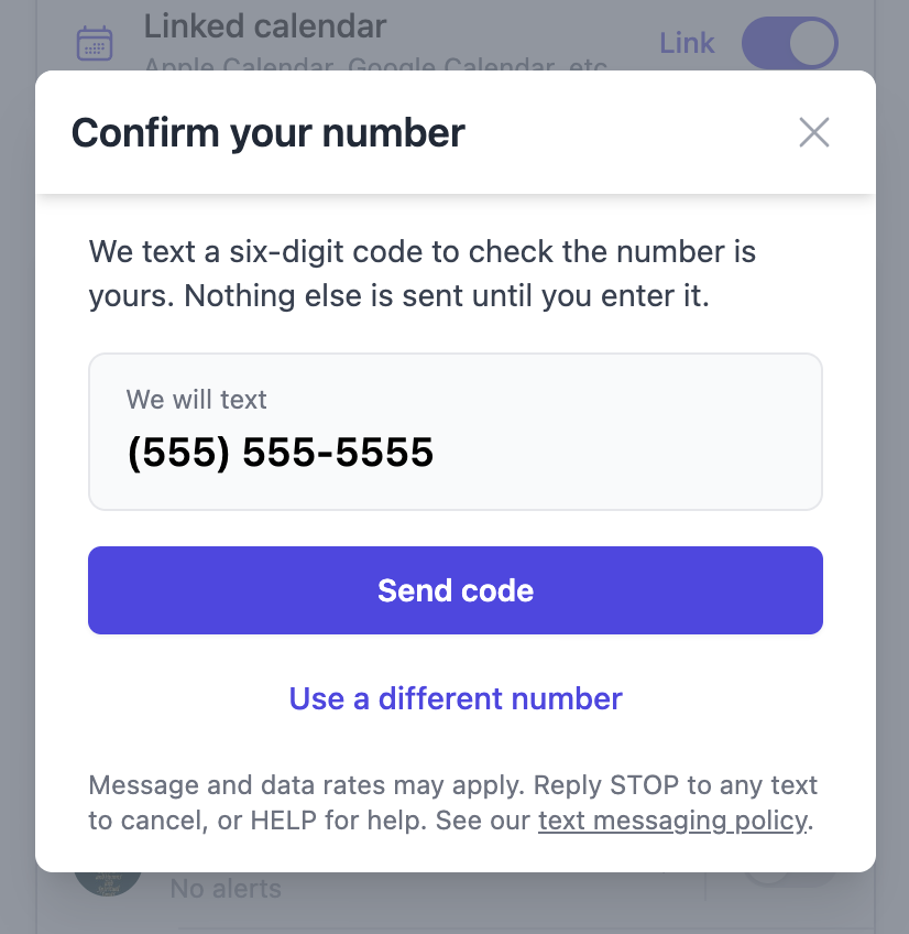 A dialog headed Confirm your number, showing the number to be texted, a Send code button, and the notice that message and data rates may apply, that replying STOP cancels and HELP gets help, with a link to the text messaging policy.